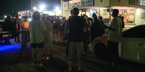 A candlelit vigil was held by the local community to pay their respects to the infamous vigilante (Fox 2)